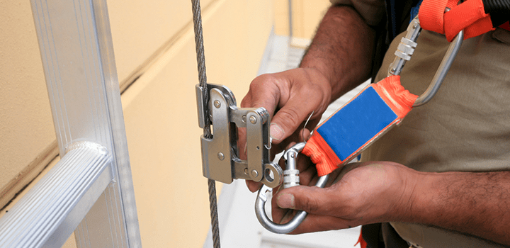 Protect workers from falls on fixed ladders